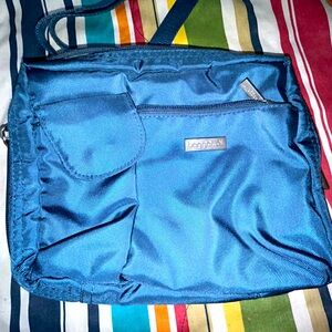 Blue canvas Baggalinni bag.